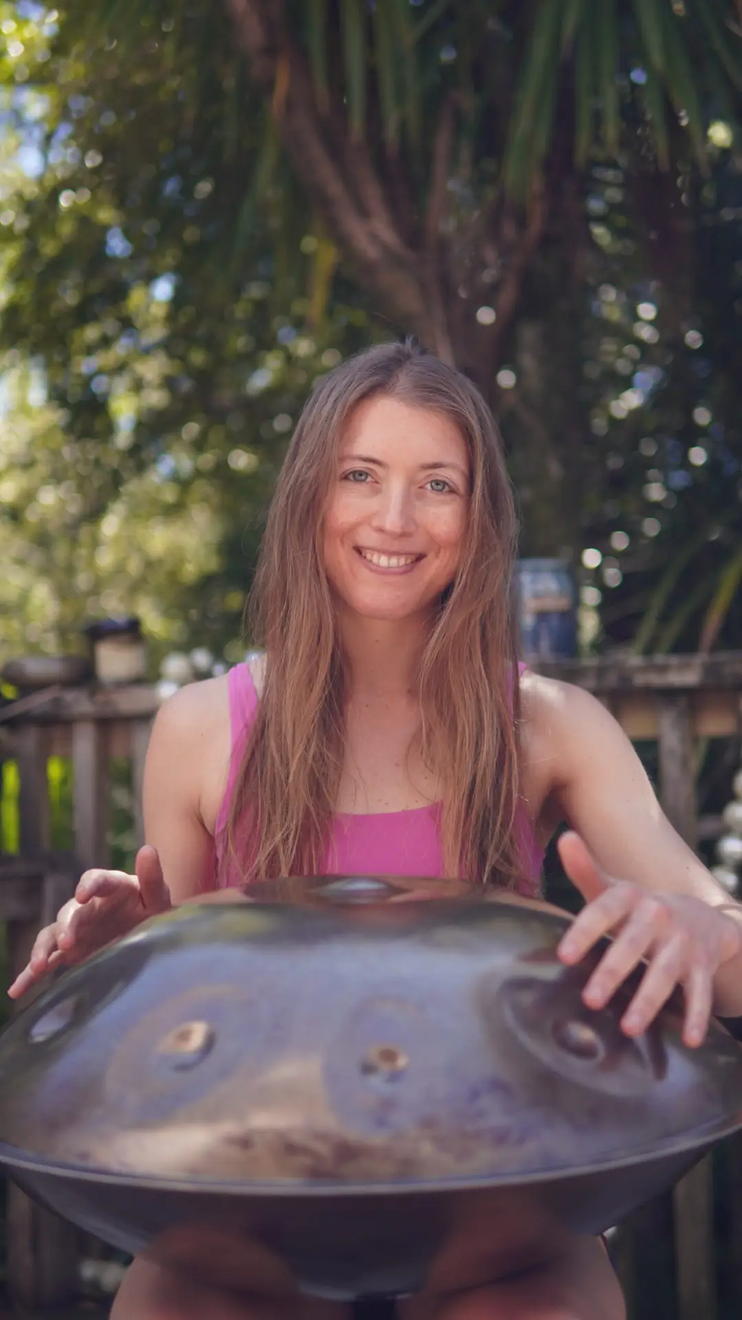 Dr Jeanette Rapson playing handpan, embodying the essence of wellness, balance, and creativity